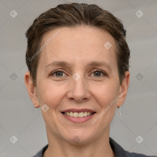 Joyful white adult female with short  brown hair and grey eyes