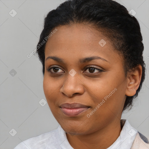 Joyful black young-adult female with medium  brown hair and brown eyes