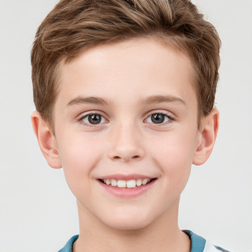 Joyful white child male with short  brown hair and grey eyes