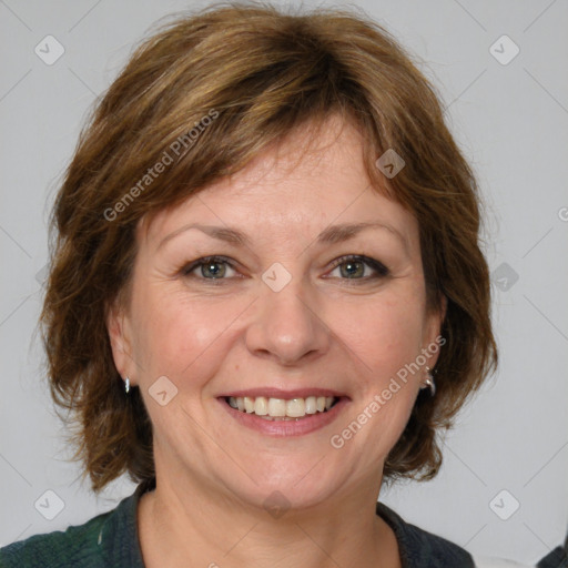 Joyful white adult female with medium  brown hair and grey eyes