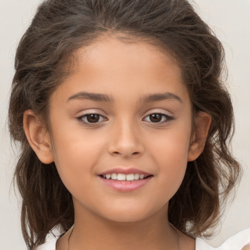 Joyful white child female with medium  brown hair and brown eyes