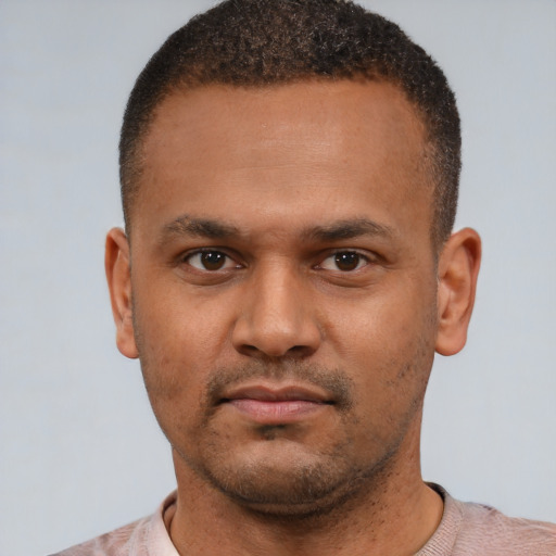 Neutral latino young-adult male with short  brown hair and brown eyes