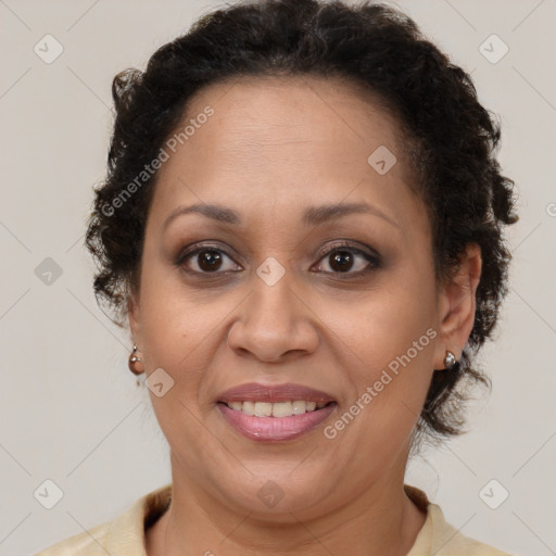 Joyful black adult female with short  brown hair and brown eyes