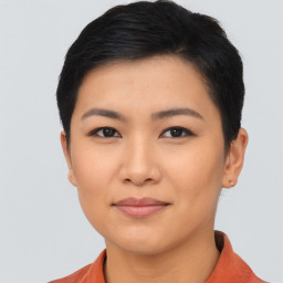 Joyful asian young-adult female with short  black hair and brown eyes