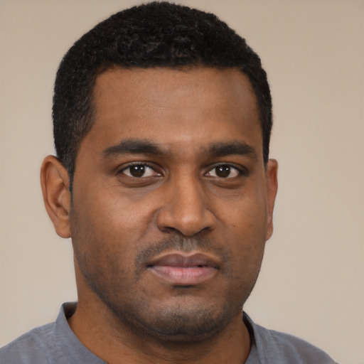 Neutral black young-adult male with short  black hair and brown eyes