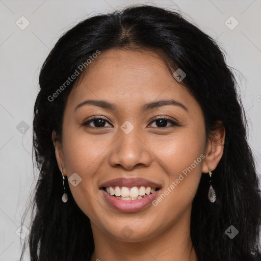 Joyful latino young-adult female with long  brown hair and brown eyes