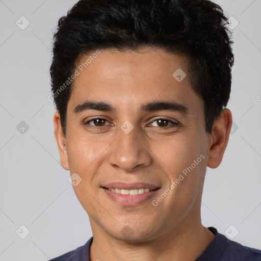 Joyful white young-adult male with short  black hair and brown eyes