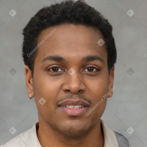 Joyful black young-adult male with short  brown hair and brown eyes