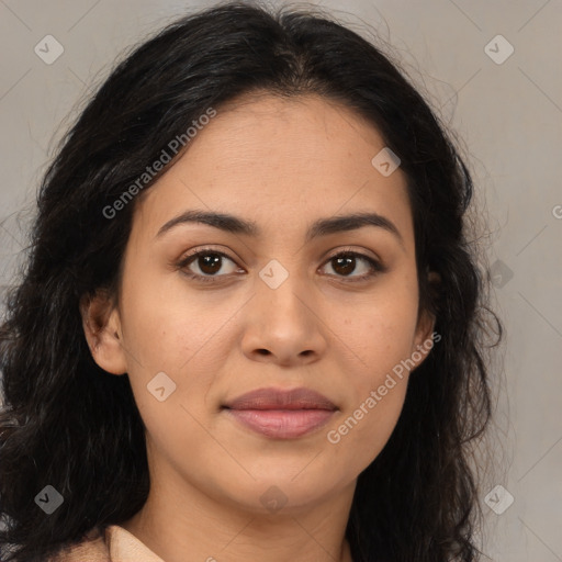 Joyful latino young-adult female with medium  brown hair and brown eyes