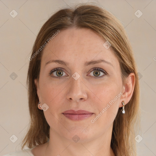 Joyful white adult female with medium  brown hair and blue eyes