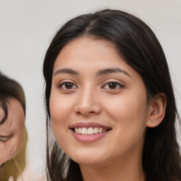 Joyful asian young-adult female with medium  black hair and brown eyes