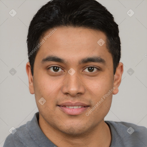 Joyful latino young-adult male with short  brown hair and brown eyes