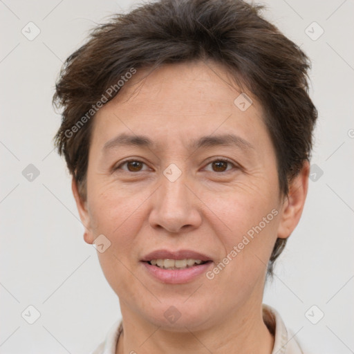 Joyful white adult female with short  brown hair and brown eyes