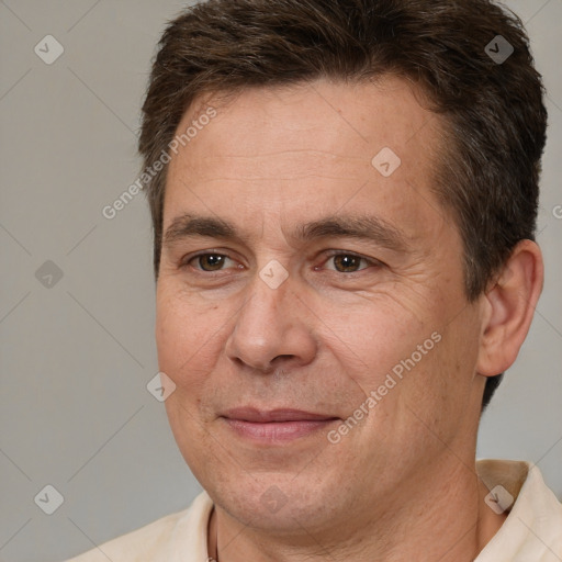 Joyful white adult male with short  brown hair and brown eyes