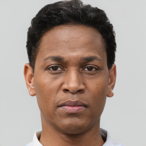 Neutral black young-adult male with short  brown hair and brown eyes