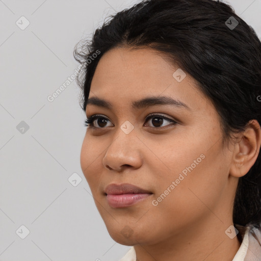 Joyful asian young-adult female with medium  black hair and brown eyes