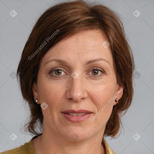 Joyful white adult female with medium  brown hair and grey eyes