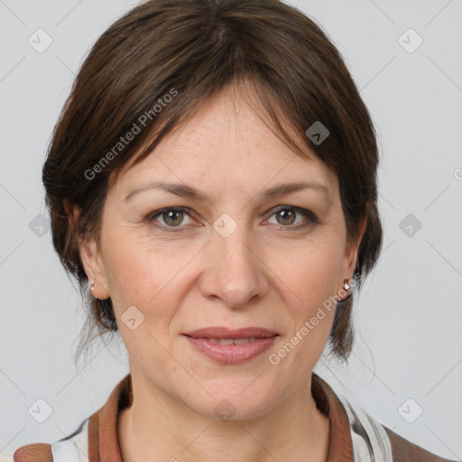 Joyful white adult female with medium  brown hair and grey eyes