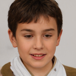 Joyful white child male with short  brown hair and brown eyes