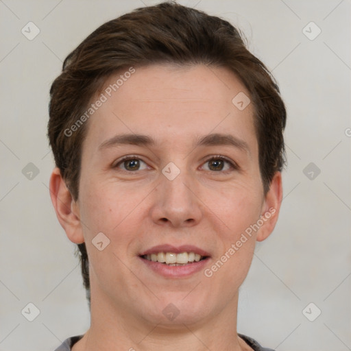 Joyful white young-adult female with short  brown hair and grey eyes