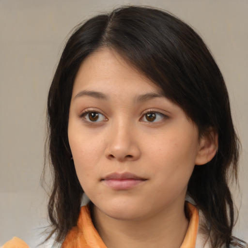 Neutral asian young-adult female with medium  brown hair and brown eyes