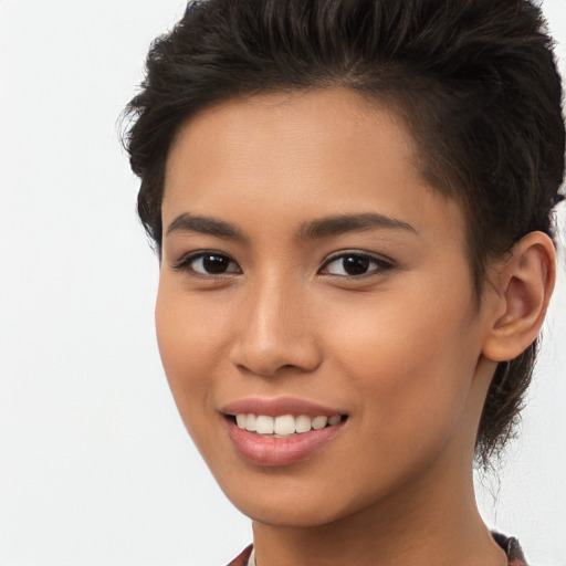 Joyful asian young-adult female with short  brown hair and brown eyes