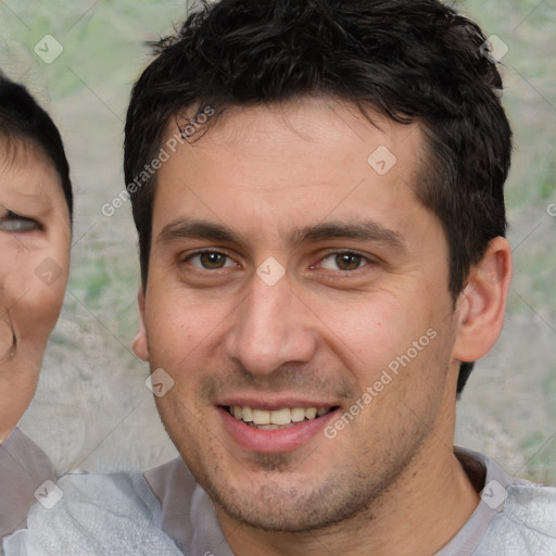 Joyful white young-adult male with short  brown hair and brown eyes