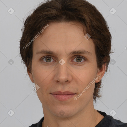 Joyful white adult female with short  brown hair and brown eyes