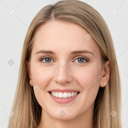 Joyful white young-adult female with long  brown hair and green eyes