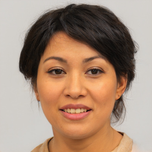 Joyful asian young-adult female with medium  brown hair and brown eyes