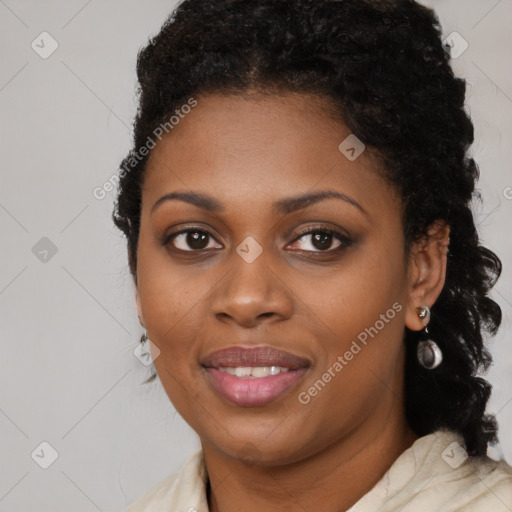 Joyful black young-adult female with medium  black hair and brown eyes