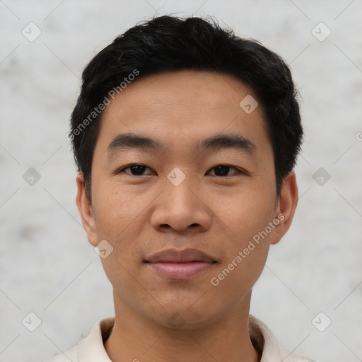 Joyful asian young-adult male with short  black hair and brown eyes