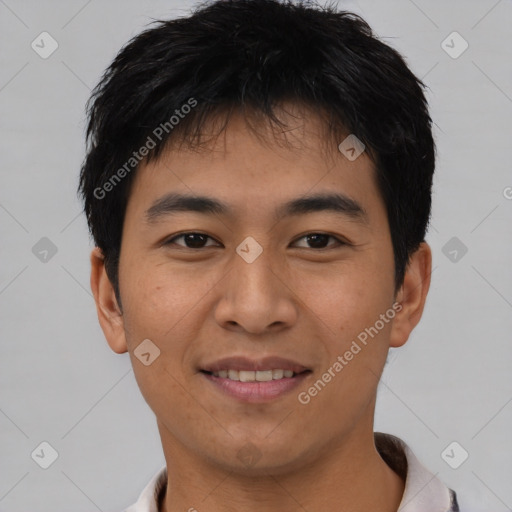 Joyful asian young-adult male with short  black hair and brown eyes