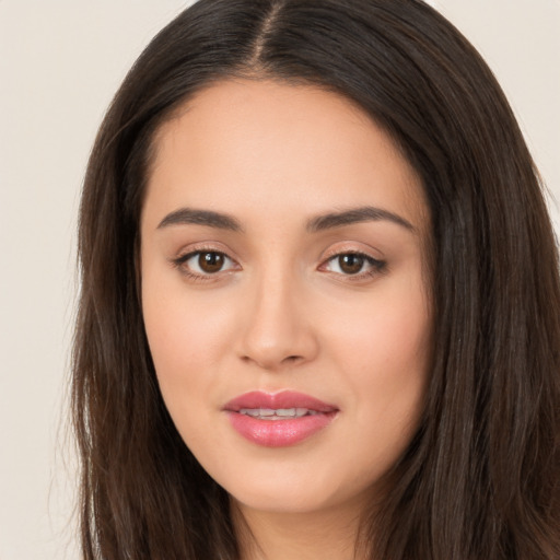 Joyful white young-adult female with long  brown hair and brown eyes