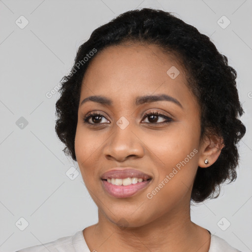 Joyful latino young-adult female with long  black hair and brown eyes