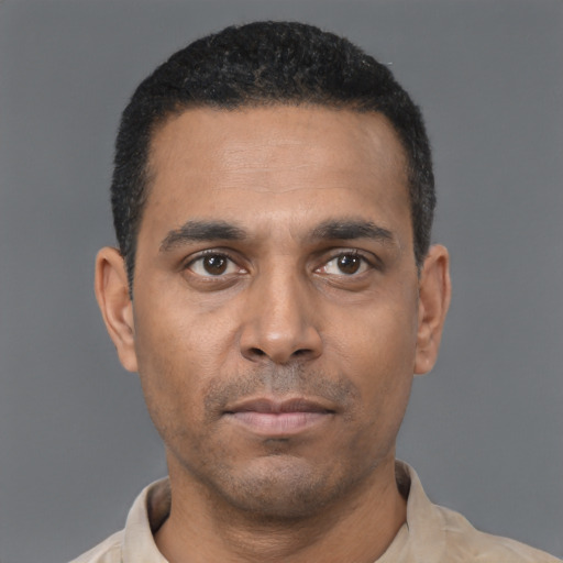 Neutral black young-adult male with short  black hair and brown eyes
