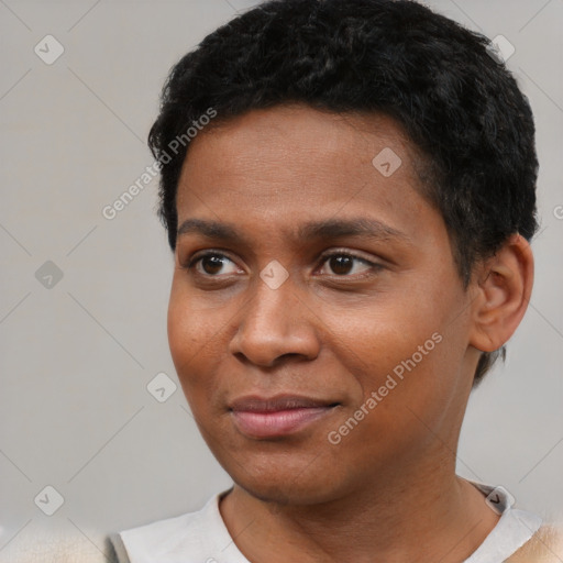 Joyful black young-adult male with short  black hair and brown eyes