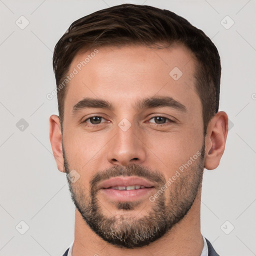 Joyful white young-adult male with short  brown hair and brown eyes