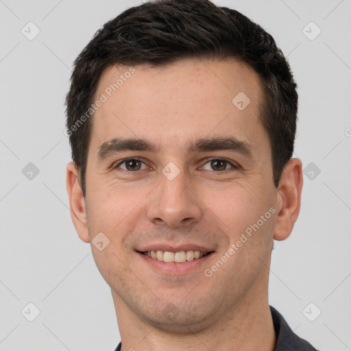 Joyful white young-adult male with short  brown hair and brown eyes