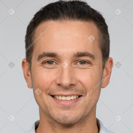 Joyful white adult male with short  brown hair and brown eyes