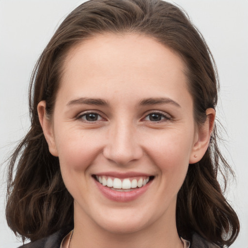 Joyful white young-adult female with long  brown hair and grey eyes