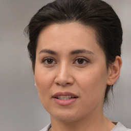 Joyful white young-adult female with medium  brown hair and brown eyes