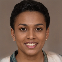 Joyful latino young-adult female with short  brown hair and brown eyes