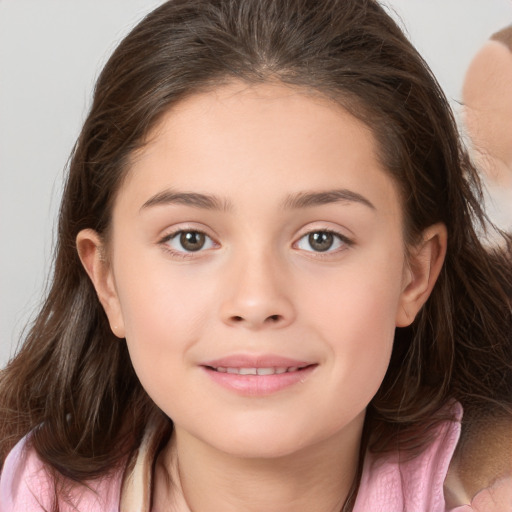 Joyful white child female with medium  brown hair and brown eyes