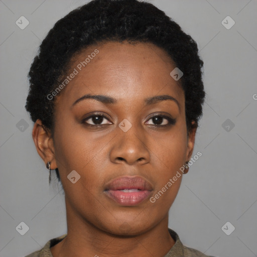 Joyful black young-adult female with short  black hair and brown eyes