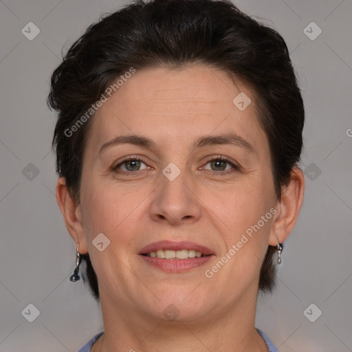 Joyful white adult female with short  brown hair and brown eyes