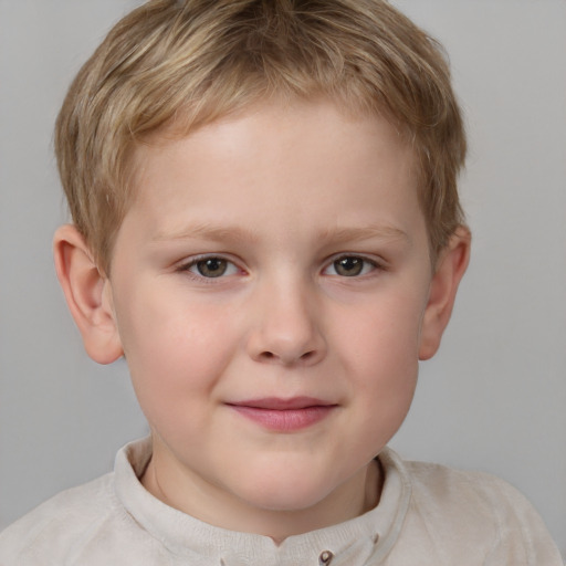 Joyful white child male with short  brown hair and grey eyes