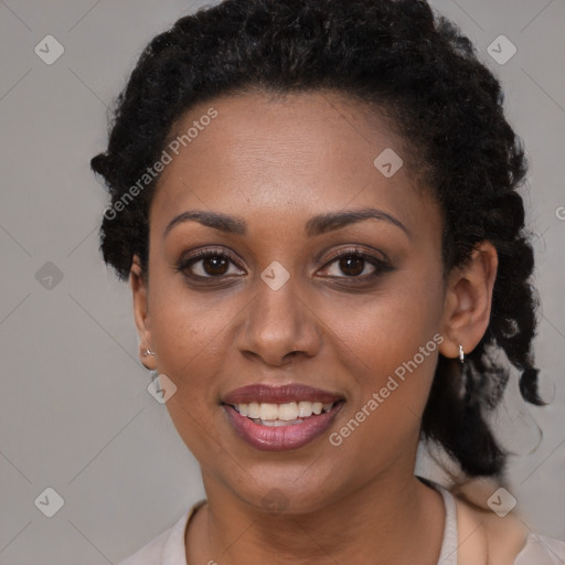 Joyful black young-adult female with short  brown hair and brown eyes