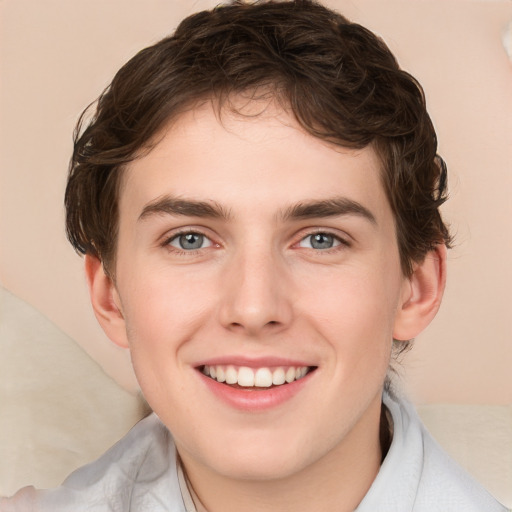 Joyful white young-adult male with medium  brown hair and brown eyes