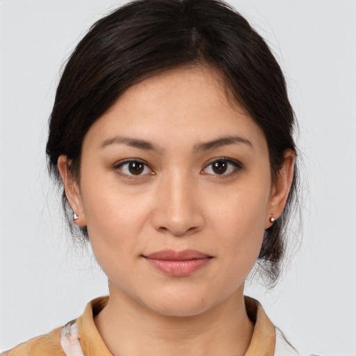 Joyful white young-adult female with medium  brown hair and brown eyes